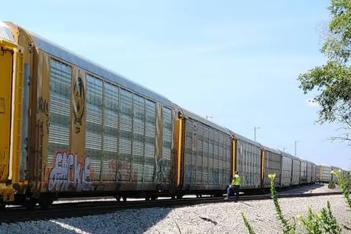 Enclosed autorack rail cars used to transport vehicles